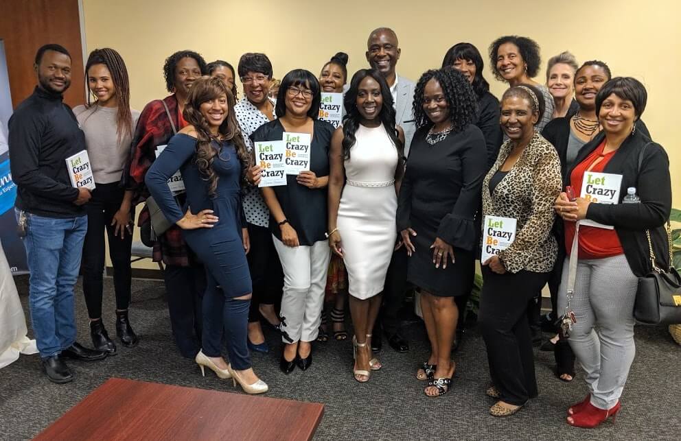 A large group of professionals pose for the camera