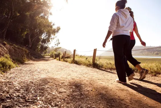 Two women enjoy a stroll on one of Carlsbad's many trails