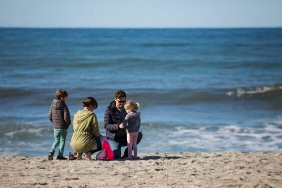 Family gathers on one of the Carlsbad, California beaches